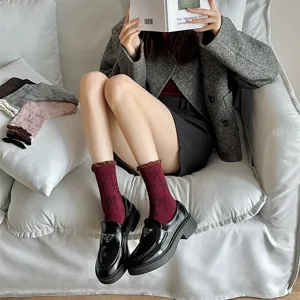 Korean ins style bow mid-tube socks for women with contrast color bubble edge and slouch fit.