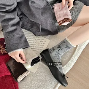 Korean sweet bow print mid-tube socks with contrast color bubble cuffs for daily wear.