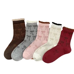 Korean style ins sweet bow mid-tube socks for women featuring contrast color bubble cuffs.