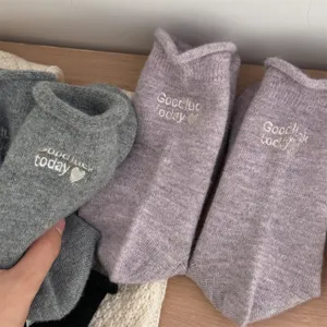 Winter thick rolled-edge wool socks with letter embroidery, cozy mid-tube thermal socks for women.