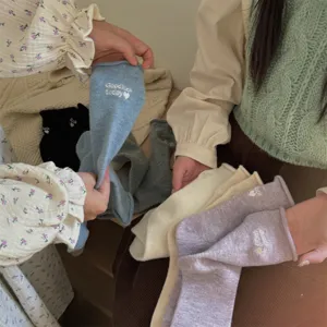 Cozy wool mid-tube socks with cute embroidered letter details, thickened and warm for winter.