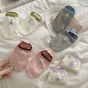 Comfortable women ankle socks with contrast color cuffs and cute button embroidery for daily wear.