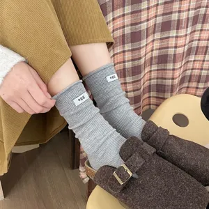 Women Japanese rolled edge slouch socks, solid color mid tube socks with cute label, cozy wear.