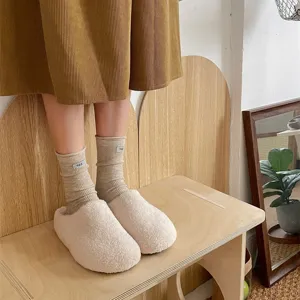 Cozy ribbed slouch socks with cute egg tag and soft plush slippers, perfect for winter warm home wear.