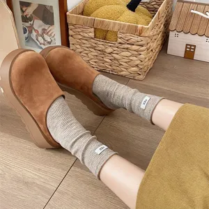 Cozy Japanese style stackable mid-tube socks, solid color soft fabric for autumn and winter daily wear.