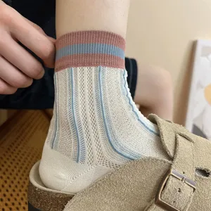 Summer women breathable mesh mid-calf socks with vertical stripes and stylish color cuffs.