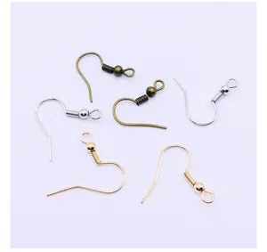 Close-up detail shot of various metal plated spring earring hooks for DIY jewelry making crafts.