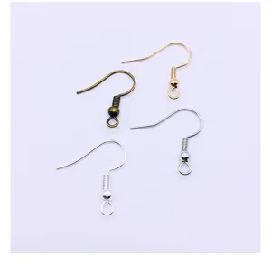 Close-up detail of assorted metal earring hooks for DIY jewelry making and handmade crafts.