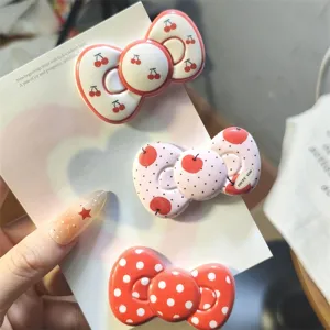 Red polka dot cherry bow hair clips cute aesthetic hair accessories for women and girls detail