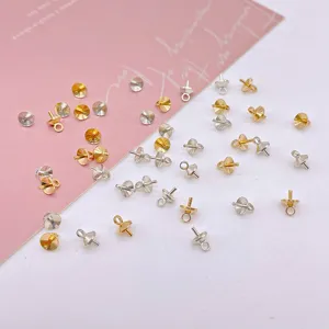 DIY jewelry findings metal bead caps with loops and pins in gold and silver colors for crafts.