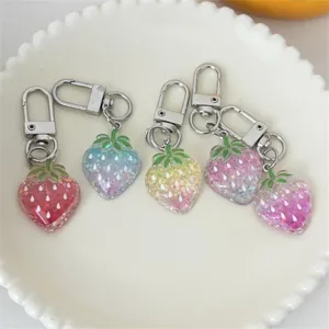 Sparkling glitter gradient strawberry keychains, cute bag pendants and sweet student gifts.