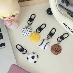 Creative sports ball keychains detail featuring basketball, soccer and tennis bag pendants.