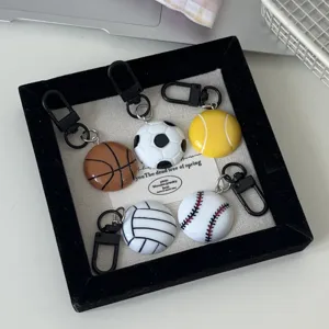 Close-up detail of creative sports ball keychains, including basketball, soccer, and tennis designs.