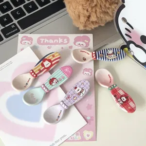Cute West Highland white dog ceramic spoons set with colorful stripes and plaid handle designs.