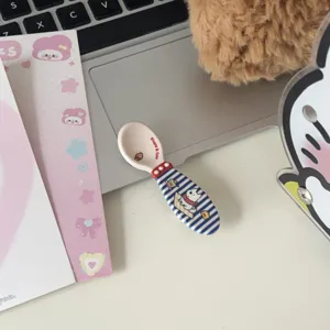 Detailed close-up view of cute Westie ceramic spoon with blue stripes, perfect for daily use.