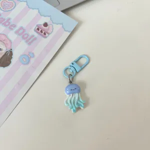 Cute blue jellyfish keychain pendant, adorable cartoon marine animal bag charm for keys.