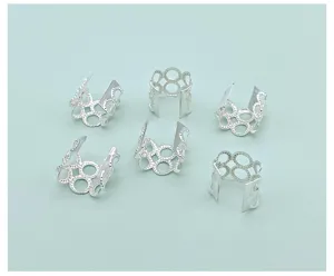 Close-up detail of silver electroplated hollow dreadlock hair rings for DIY hair styling and braids.
