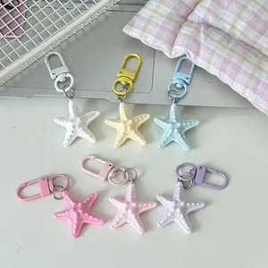 Cute pastel starfish keychain set, aesthetic bag charm and sweet couple gift accessory.