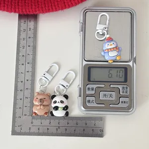 Cute cartoon animal keychains featuring adorable penguin, panda and bear designs with hooks.