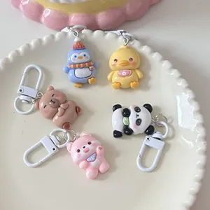 Cute cartoon animal keychains set, adorable penguin duck bear panda puppy charms for bags and keys.
