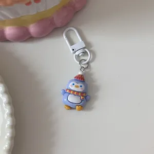 Cute winter cartoon penguin keychain metal hook backpack pendant detail close-up