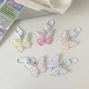 Clear jelly butterfly keychain set with floral and polka dot patterns, cute bag pendant.