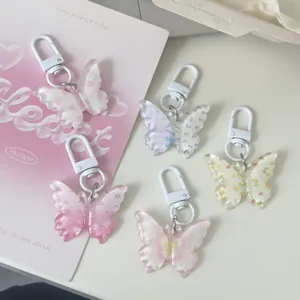 Translucent butterfly keychains with floral jelly patterns, cute bag charms for daily use.