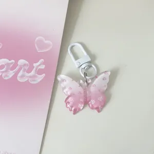 Translucent butterfly keychain with floral jelly charm, clear bag pendant for cute daily style.