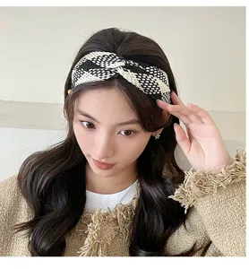 Black white woven headband detail shot, stylish plaid hair hoop accessory for women daily wear.