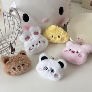 Detailed view of cute plush cartoon animal keychains including rabbit, bear, and panda pendant.