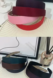 Detailed view of wide satin headbands in multi colors, simple fabric hair hoops for daily wear.