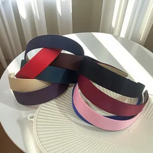 Elegant satin headband for women, colorful minimalist wide-brim fabric hair hoop.