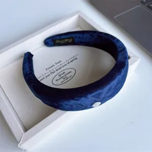 Dark blue velvet headband detail, thick padded hair hoop, soft fabric vintage hair accessory.