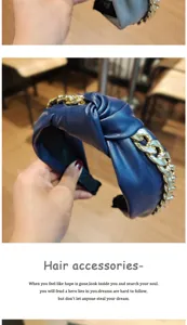 Detailed view of blue PU leather knotted headband featuring a chunky gold chain design.