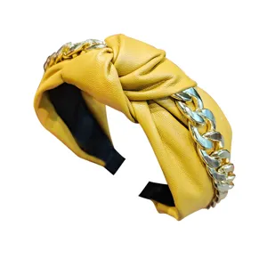 Stylish leather knotted headband with chunky chain for women, elegant luxury hair accessories.
