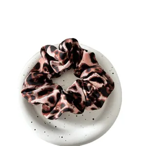 Leopard print satin hair scrunchie for women, vintage wide pleated elastic hair band styling.