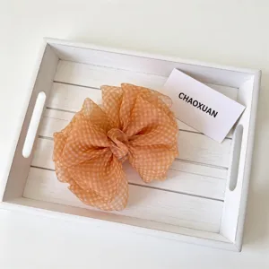 Fermaglio a banana con fiocco in organza a quadri arancione, elegante accessorio per capelli.