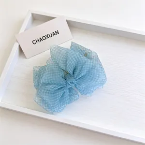 Molla per capelli con fiocco a quadretti blu stile coreano, accessorio elegante e chic.