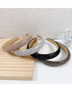 Detail shot of sparkling rhinestone padded headbands showcasing multiple elegant color variants.