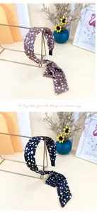 Detailed view of French polka dot headband with long ribbon bow, elegant hair accessory.