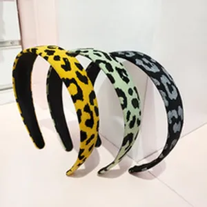 Leopard print wide headband detail view, showcasing fabric texture and trendy color options.