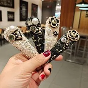 Chic tweed hair clips set with pearl and camellia flower decorations for women and girls daily.