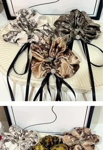 Vintage floral satin hair scrunchies with black ribbons and crystal detail for elegant styling.