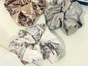 Detailed close-up shot of retro Chinese ink style floral hair scrunchies set of three pieces.