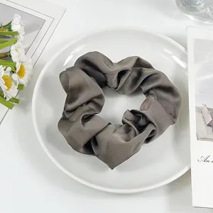 Gray satin hair scrunchie for women, elegant elastic hair tie and daily hair accessories.