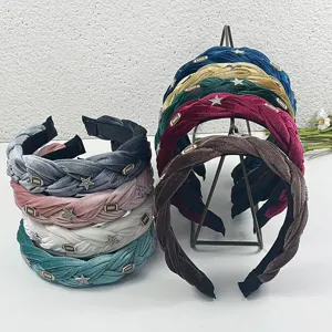 Detailed view of wide velvet braided headbands featuring rhinestone star charms and elegant style.