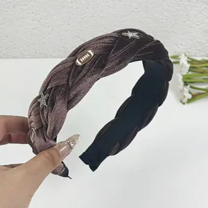 Wide star velvet braided headband detail view, chic autumn winter brown hair accessory for women.