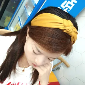 Yellow fabric knotted headband for women, wide brim hair hoop, stylish hair accessories.