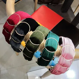 Velvet headband detail featuring chic metal rings, showing multiple vibrant color options.