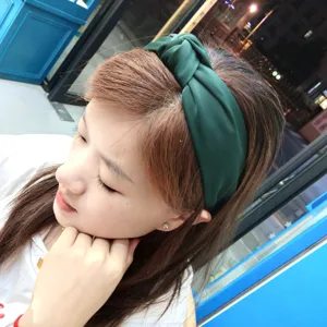 Dark green fabric knotted headband for women, wide hair hoop for daily fashion styling and comfort.